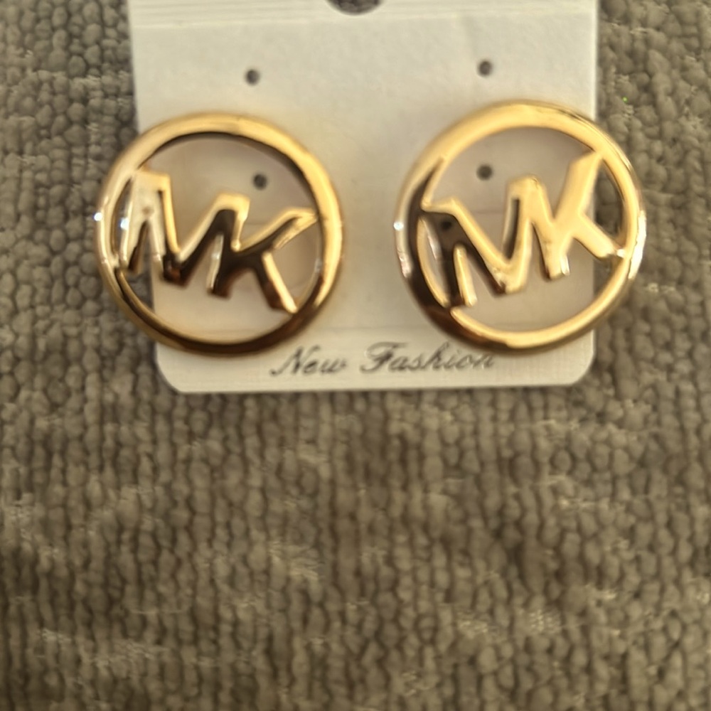 MK costume stud earrings